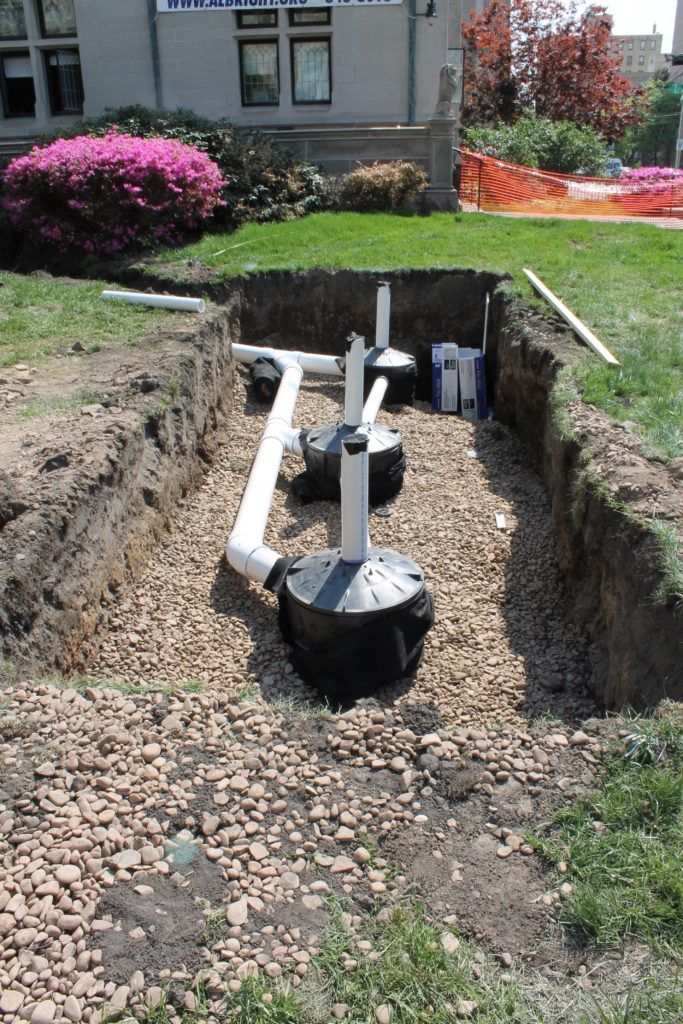 May 2015: Work begins to install rain barrels underground at the Scranton Public Library.